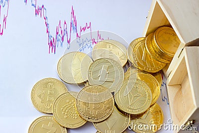 Cryptocurrencies emptied from a wooden box Editorial Stock Photo