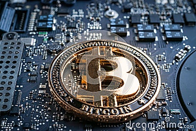 Cryptocurrency background. Gold Bitcoin Computer electronic circuit board motherboard. CryptoCash Mining and electronic Stock Photo