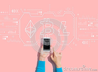 Cryptocurrency - Bitcoin, Ethereum, Litecoin with person using a smartphone Editorial Stock Photo