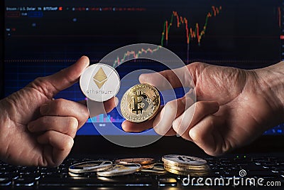 Cryptocurrency concept with hands holding bitcoin and ethereum coin Editorial Stock Photo