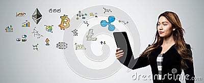 Cryptocurrency with woman holding a tablet computer Editorial Stock Photo