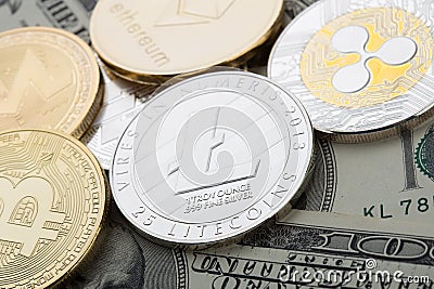 Cryptocurrency coins - Bitcoin and other close up Editorial Stock Photo