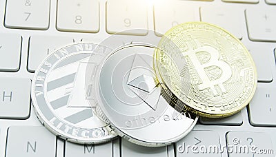 Cryptocurrency coins - Litecoin, Bitcoin, Ethereum, Ripple cryptocurrency concept stock of physical bitcoins gold and silver coins Editorial Stock Photo
