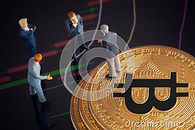 Cryptocurrency concept with businessmen and bitcoin Stock Photo