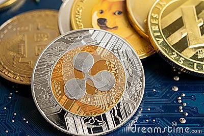 Cryptocurrency electronic coins on circuit mainboard computer, worldwide exchange virtual money, blockchain online concept Editorial Stock Photo