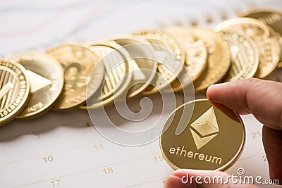 Cryptocurrency golden Bitcoin,Litecoin ,Ethereum coin on calendar, selective focus on Ethereum , digital currency concept Editorial Stock Photo
