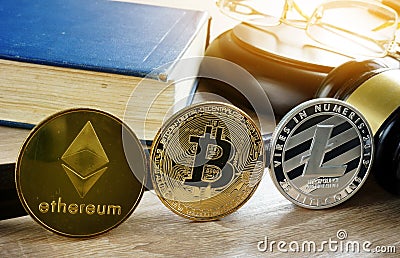 Cryptocurrency market regulation. Crypto coins and gavel on a desk. Editorial Stock Photo