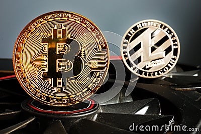 Cryptocurrency mining. Bitcoin BTC and Litecoin LTC coins. Stock Photo