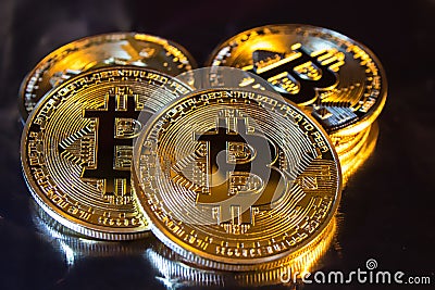 Cryptocurrency physical golden bitcoin coin on colorful background Stock Photo