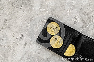 Cryptocurrency physical golden bitcoin coins for changing or selling stone background top view mock up Stock Photo