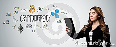 Cryptocurrency with woman holding a tablet computer Stock Photo