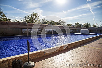 the crypts of Martin Luther King and Coretta Scott King surrounded by a pool of rippling water with blue tile Editorial Stock Photo