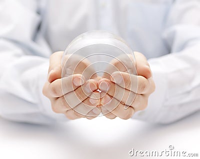 Crystal ball in hands Stock Photo