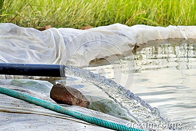 crystal clear sweet and healthy water being flush out. Water is flowing from water pump Stock Photo