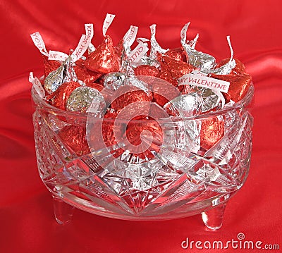 Crystal dish of chocolate kisses Stock Photo