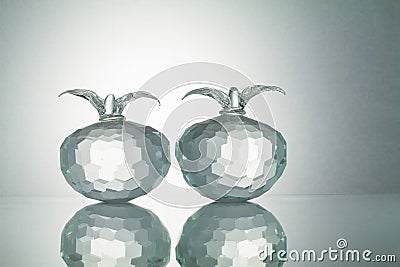 Crystal fruits with reflection on white illuminated background Stock Photo