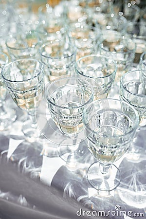 Crystal glasses with drinks on a sunny day. Hard shadows and highlights. Top view. Stock Photo