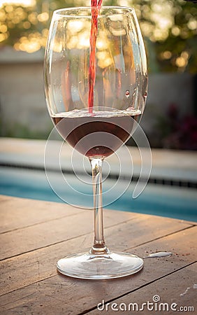 Crystal goblet with red wine. Alcoholic drink based on fermented grape juice. High social class drink concept Stock Photo