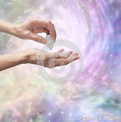 Crystal healer sensing energy with terminated quartz Stock Photo