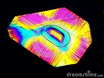 Crystal layer on microscope object glass, seen in polarized light. This causes random unforeseeable color effects Stock Photo