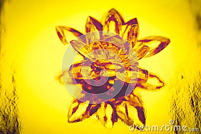 Crystal lotus on shiny yellow background with light reflection. Manipura chakra symbol Stock Photo