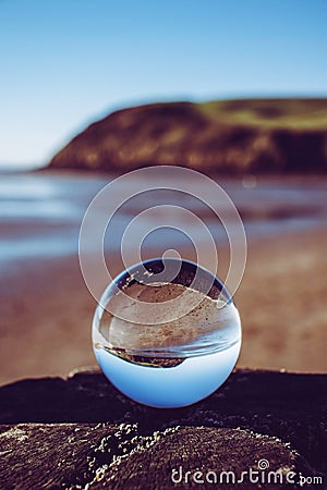 Crystal photography ball showing the seascape at St Bees Head, Whitehaven, Cumbria Stock Photo