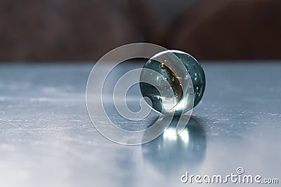 Crystal shpere on icy surface in cold tone Stock Photo