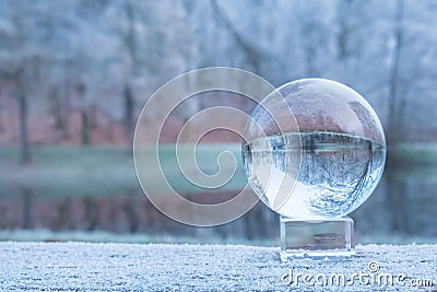 Crystall ball of a frozen nature. Winter background. Stock Photo