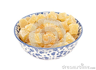 Crystallised stem ginger in a blue and white china bowl Stock Photo