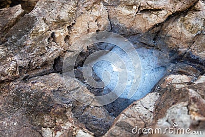 crystallization of salt caused by sea waves and crystallization on the rocks Stock Photo