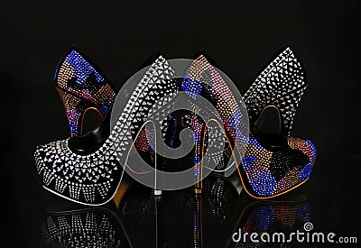 Crystals encrusted shoes collection on black Stock Photo