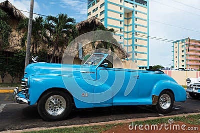 Cuba blue american classic car parked front of a building Editorial Stock Photo