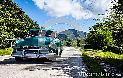 Cuba caribbean classic car drived on the street in the sierra Maestra Editorial Stock Photo