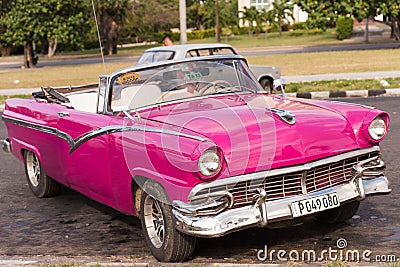 CUBA, HAVANA - MAY 5, 2017: American pink retro cabriolet on city street. Close-up. Editorial Stock Photo