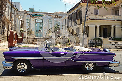 Cuba, Havana, Old Pontiac car in front of a ruined bourgeois house Editorial Stock Photo