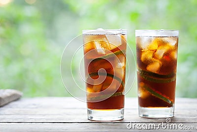 Cuba Libre or long island iced tea cocktail with strong drinks, cola, lime and ice in glass, cold longdrink or lemonade Stock Photo