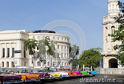 Cuba many classic cars parked in series in Havana with Capitol view Editorial Stock Photo