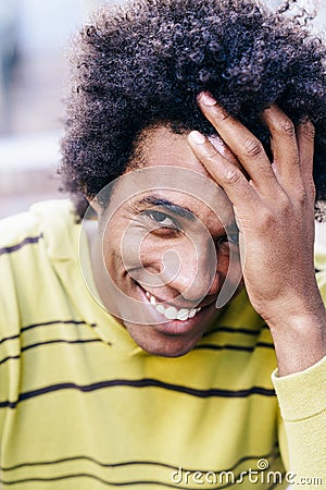 Cuban black tourist with afro hair sitting on the floor Stock Photo