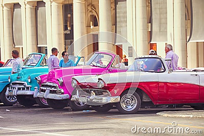 Cuban colorful vintage cars in front of the Gran Teatro Editorial Stock Photo