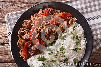 Cuban cuisine: ropa vieja meat with rice garnish closeup. Stock Photo