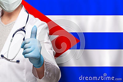 Cuban doctor's hand showing thumb up positive gesture on flag of Cuba background Stock Photo