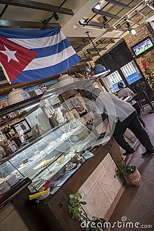 Cuban flag in cafÃ© in Havana, Cuba Editorial Stock Photo