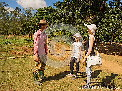 Cuban peasant talks with the tourists in the Vinales Valley Cub Editorial Stock Photo
