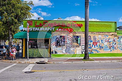 Cuban restaurant and a mural with famous latin artists in Little Havana, Miami Editorial Stock Photo