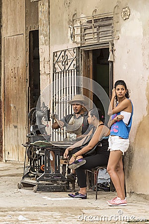 Cuban shoemaker repairing shoe Havana Editorial Stock Photo