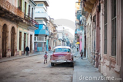 Cuban street view with Red Car Editorial Stock Photo