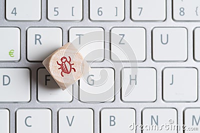 Cube with bug symbol, standing for an software error Stock Photo