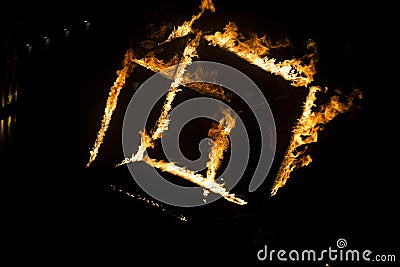 A cube of fire at night Stock Photo