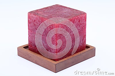 Cube Square Red Marble Candle on Teak Wood stand Stock Photo