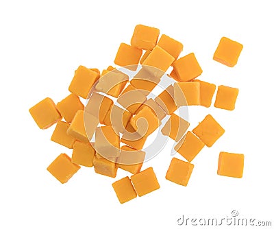 Cubed mild cheddar cheese on a white background Stock Photo